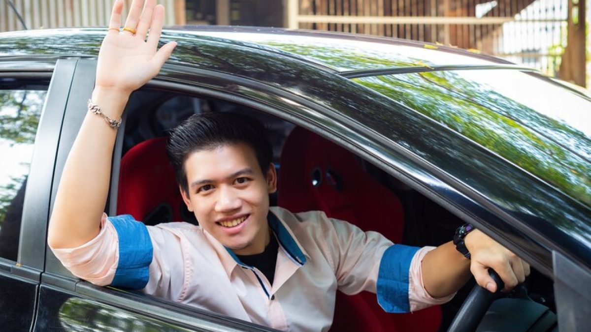 handsome-young-man-black-car_1150-14287