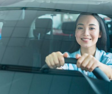 happy-woman-car-dealership_23-2148130170